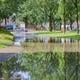 Waterleiding geknapt in Roden, deel van de weg onder water.