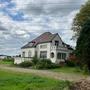 Het pand, met op de achtergrond het Beiler station